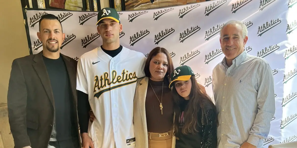 Luis Morales with family and A's executives