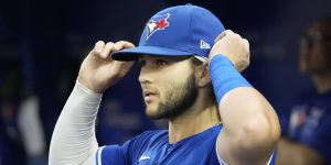 Blue Jays Shortstop Bo Bichette Fixes Hat in Blue Jays Dugout Prior to Game